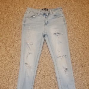 ripped light blue wax jeans